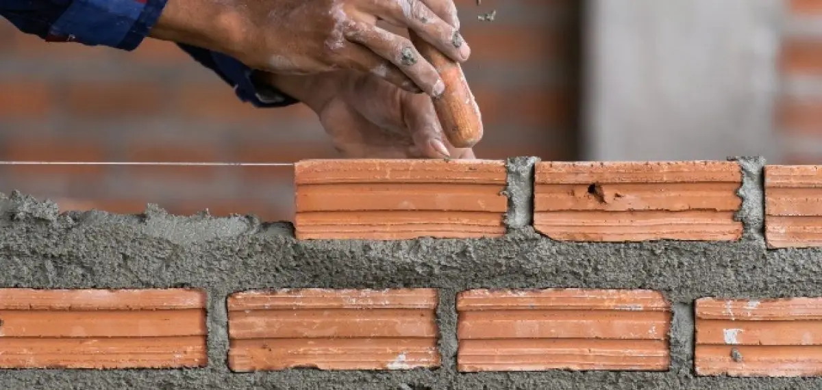 Diverse masons collaborating sustainable building construction